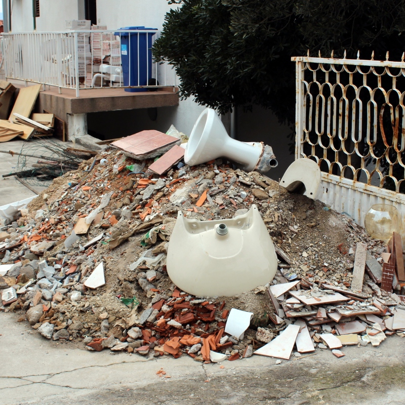 Pile of construction material waste in courtyard